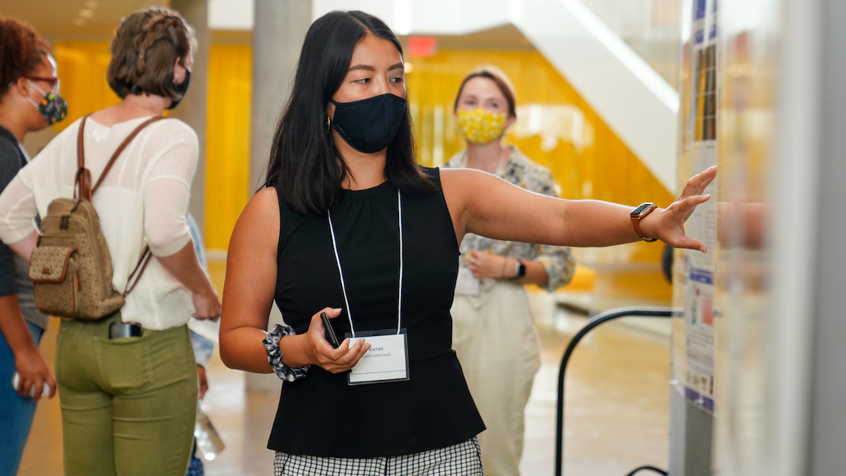 A BBS student explains their poster at the 2021 BBS symposium