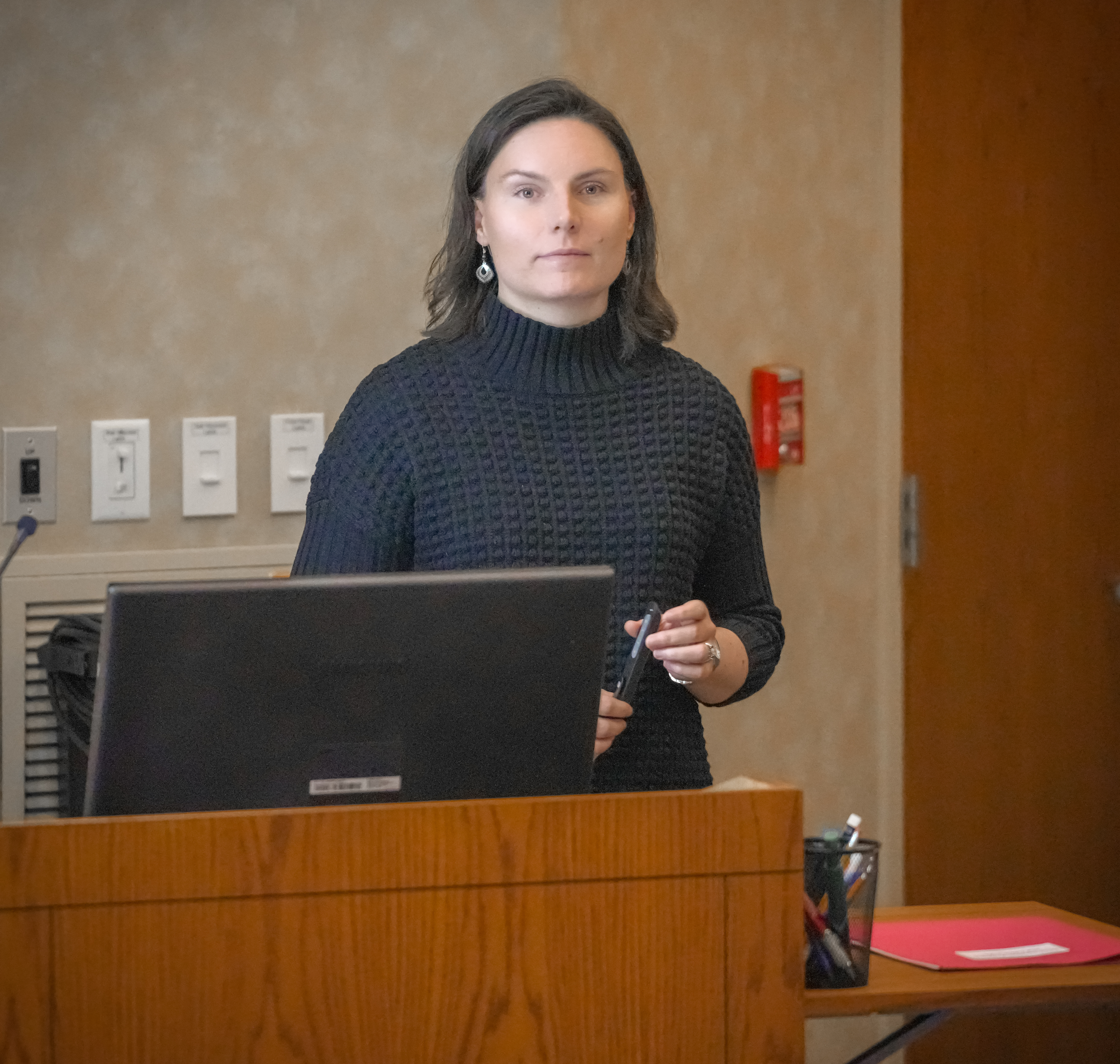 Dr. Jacquelyn Evans stands at the podium in the Thaw Lecture Hall.