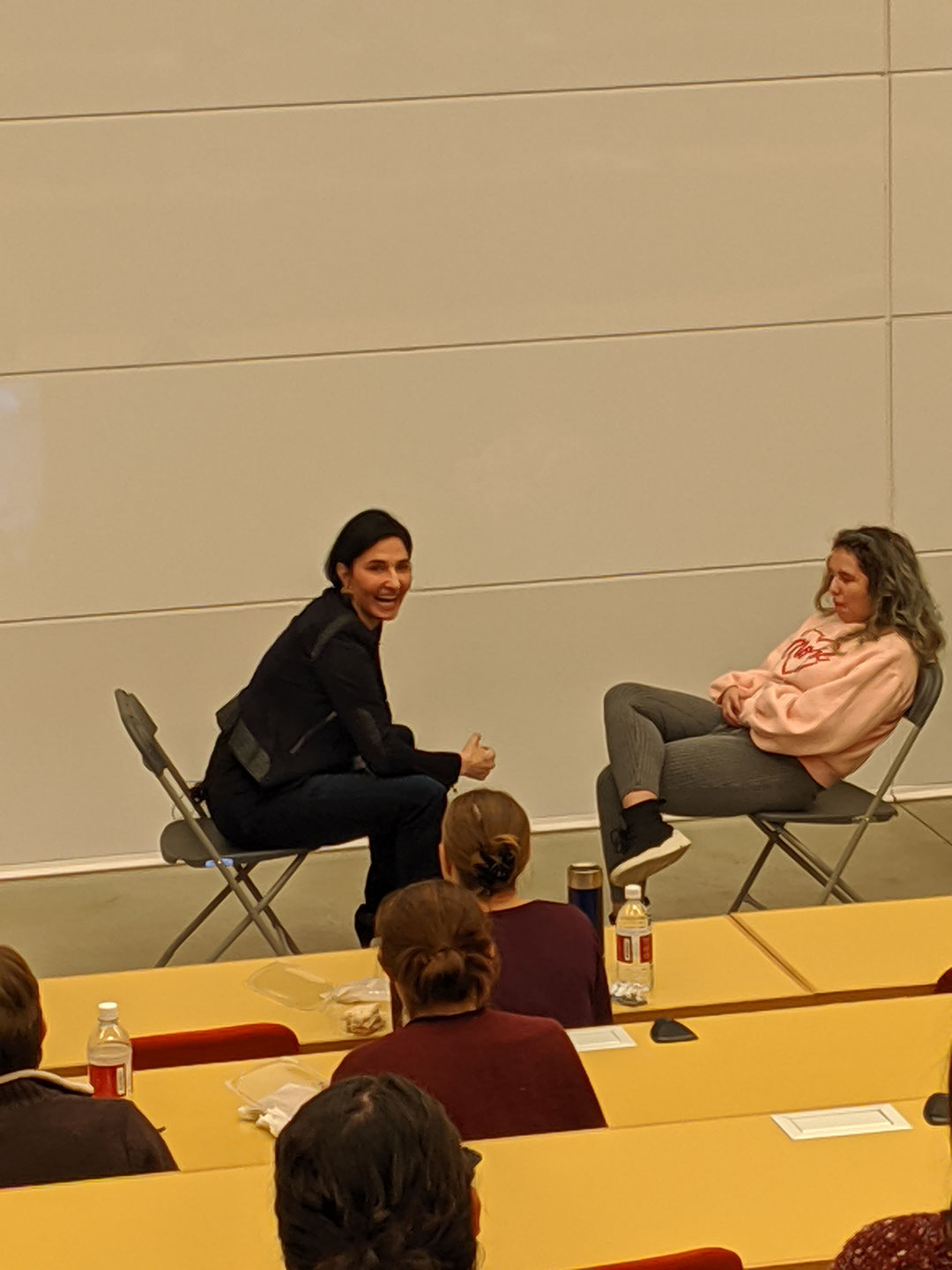 Eliza VanCort sitting opposite a student in lecture hall 4