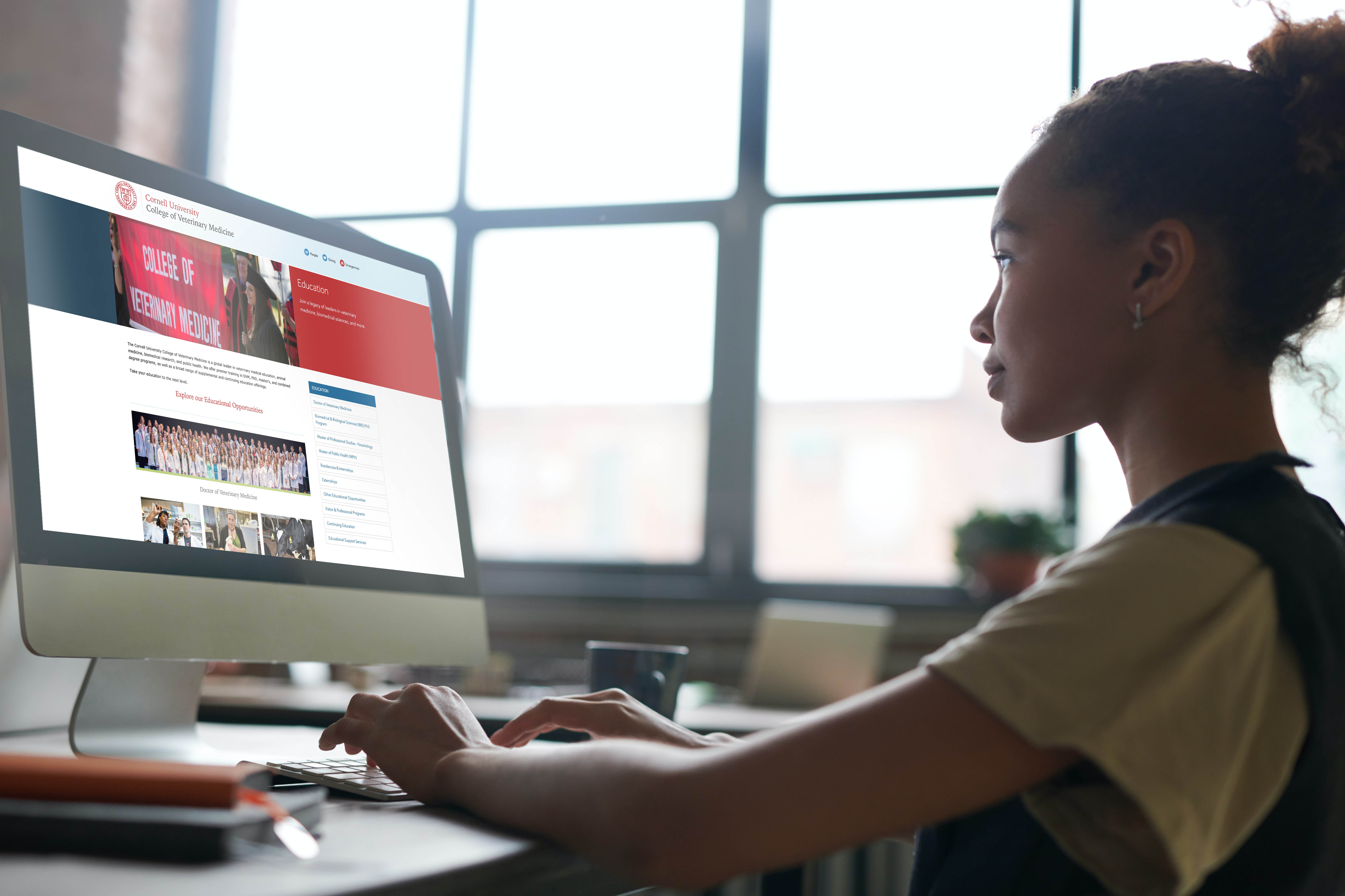 A woman looking at a laptop