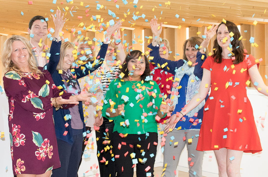 Human Resources throwing confetti into the air