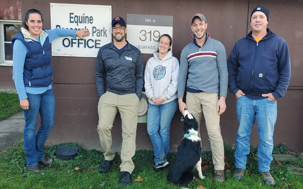 The Equine Park team stands outside the main barn