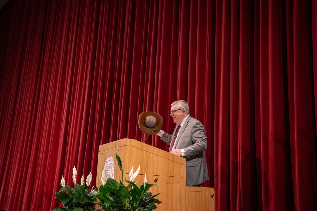 Dean Warnick holding a cowboy hat