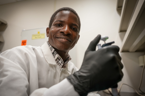 Damilola Gbore works in a lab at CVM. 