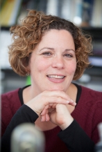 View Profile (Paula Cohen in dark red shirt with black sleeves)