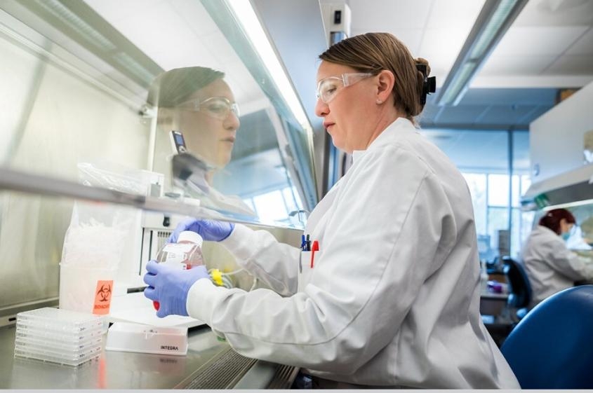 A scientist preparing samples