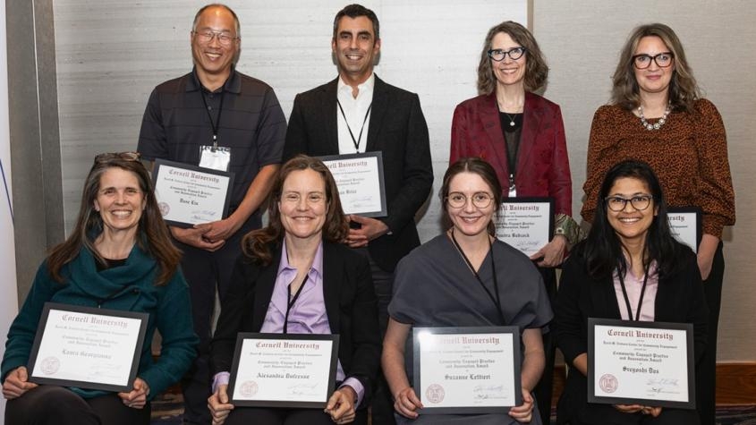 A group picture with people holding their awards