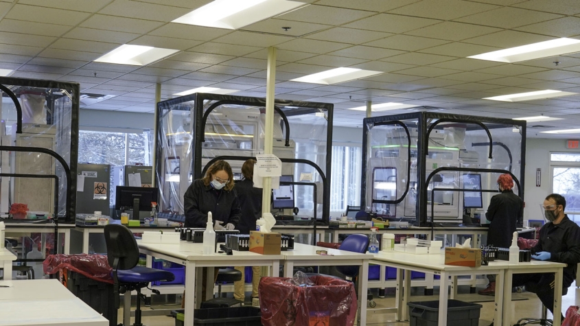 Technicians work in the COVID-19 lab