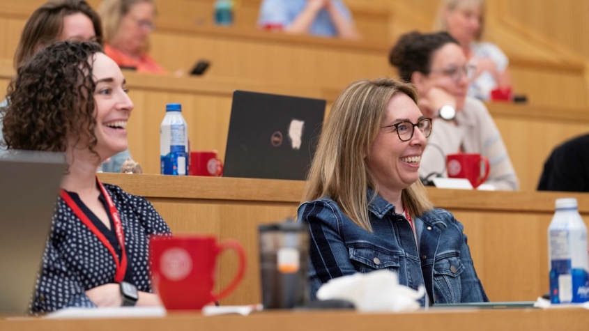 Conference attendees in lecture hall