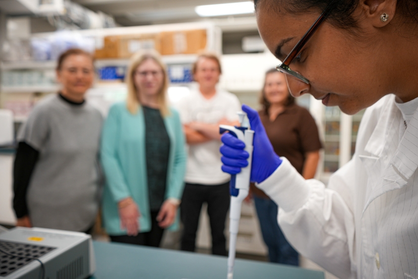 Scientist with a pipette