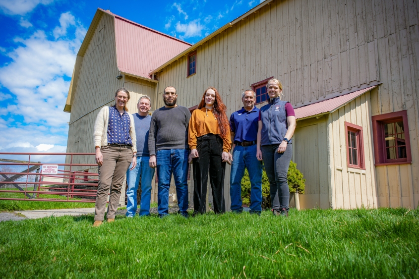 The de Mestre Lab poses in front of the McConville Barn Complex. 