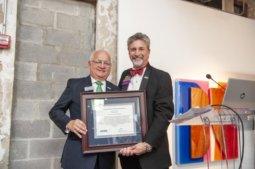 Dr. Joseph Kinnarney receiving his award