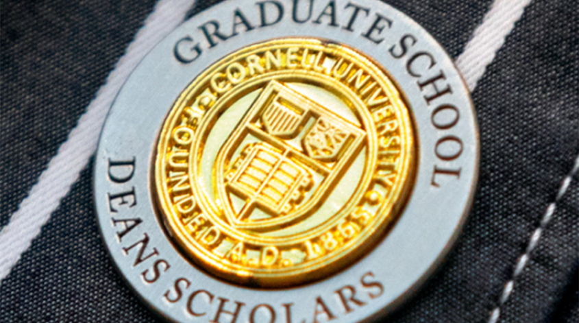 Close up of a medal that says "Deans Scholars"