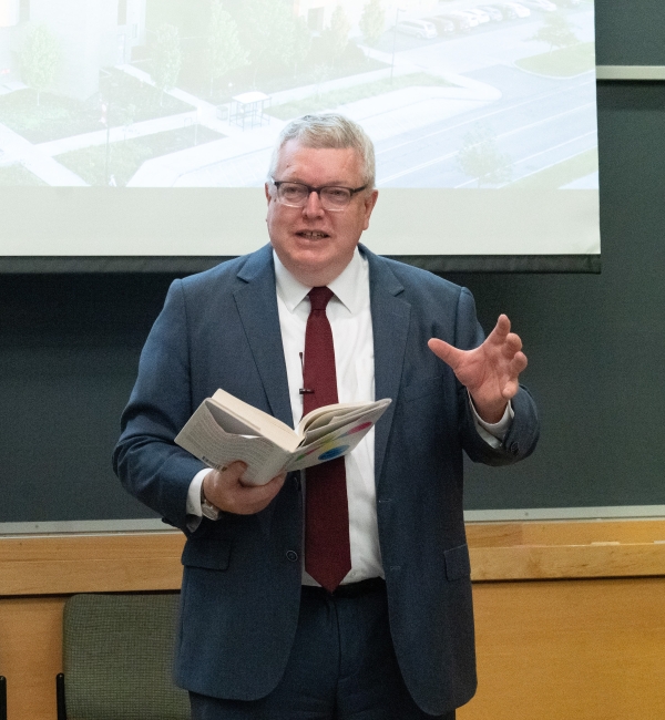 Dean Lorin Warnick with book