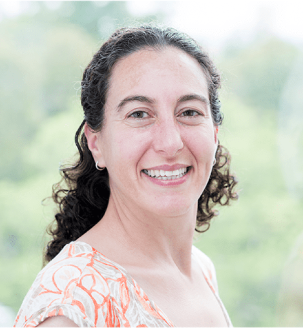Ilana Brito wearing a floral blouse.